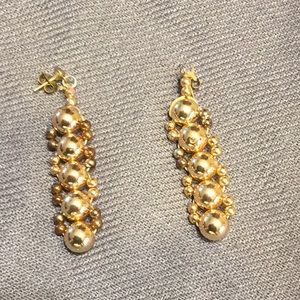 Gold earrings and bracelet.